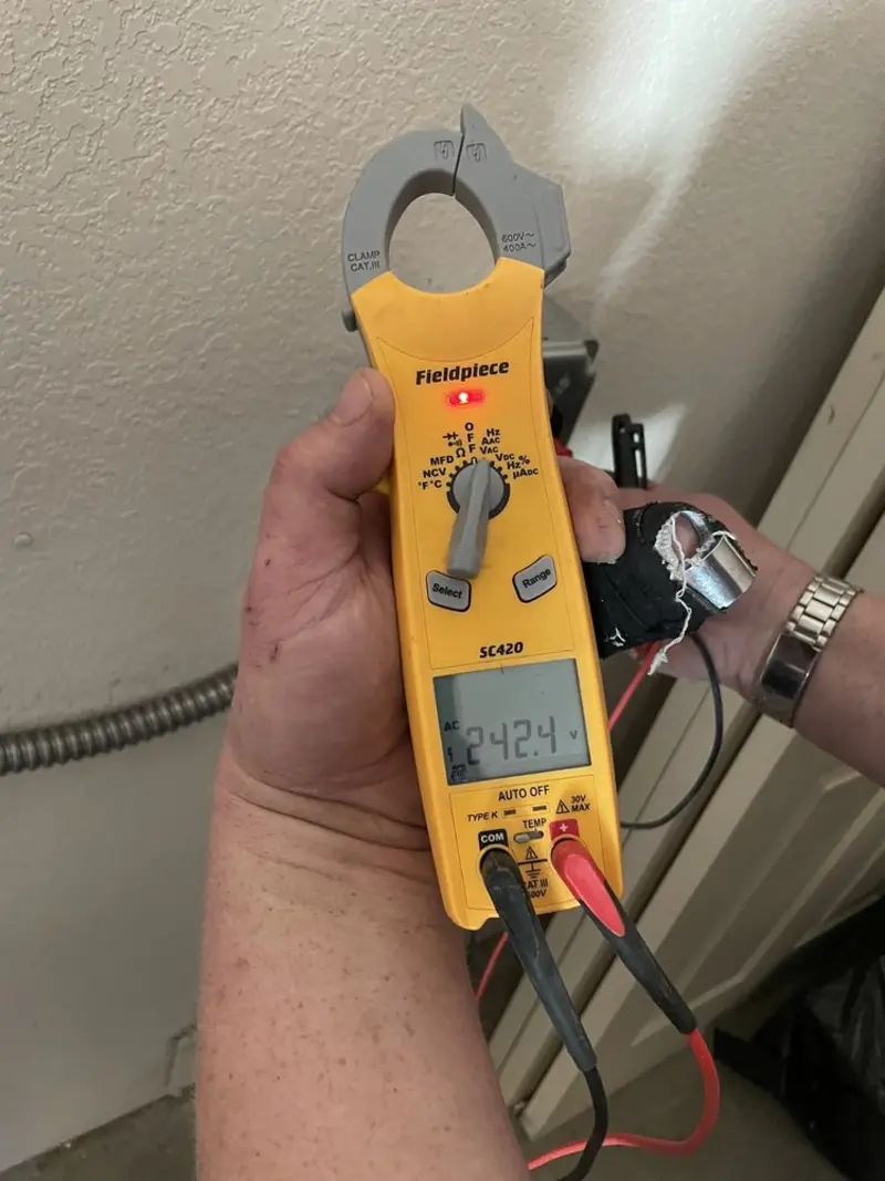Voltage testing with clamp meter during Recessed Lighting Installation in Dalton
